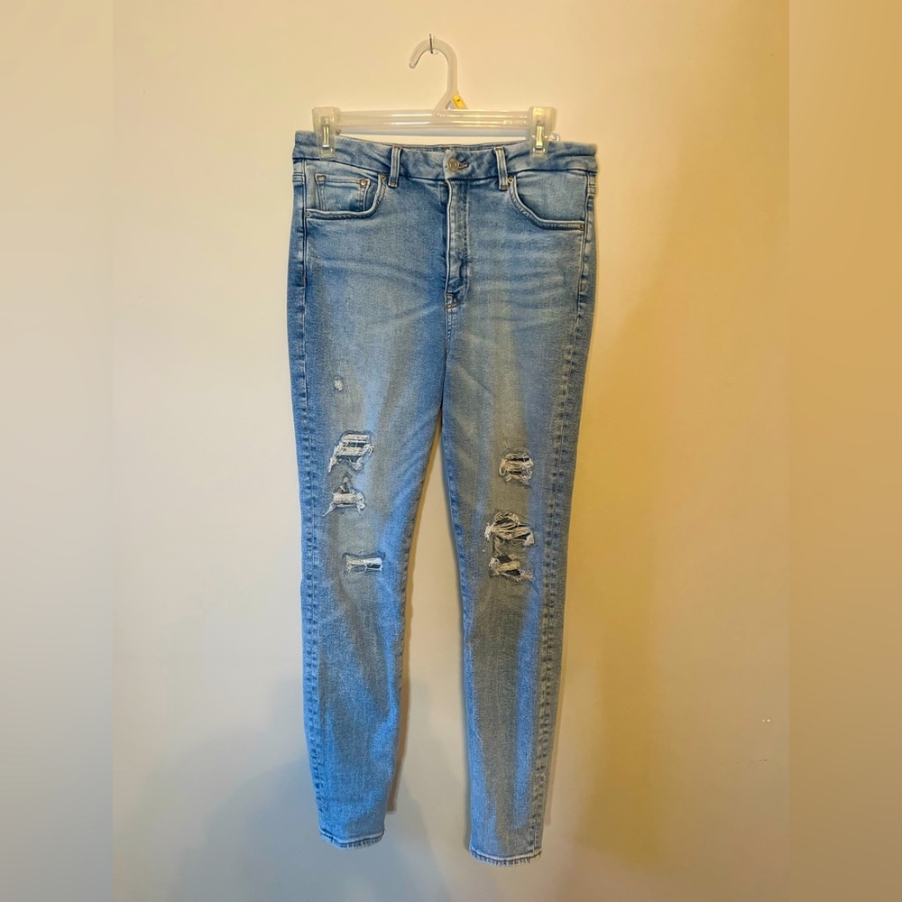 Distressed denim jeans - size 8
